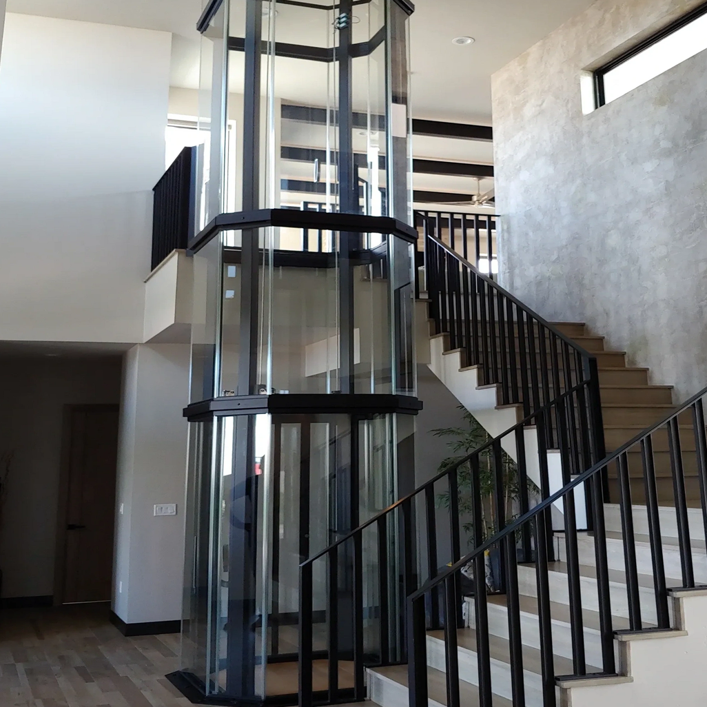 Glass elevator in modern home interior
